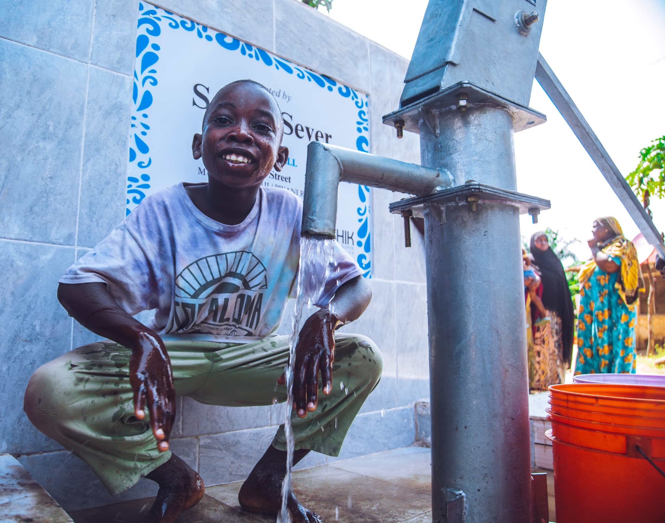 Child using a restored Embrace Relief water well