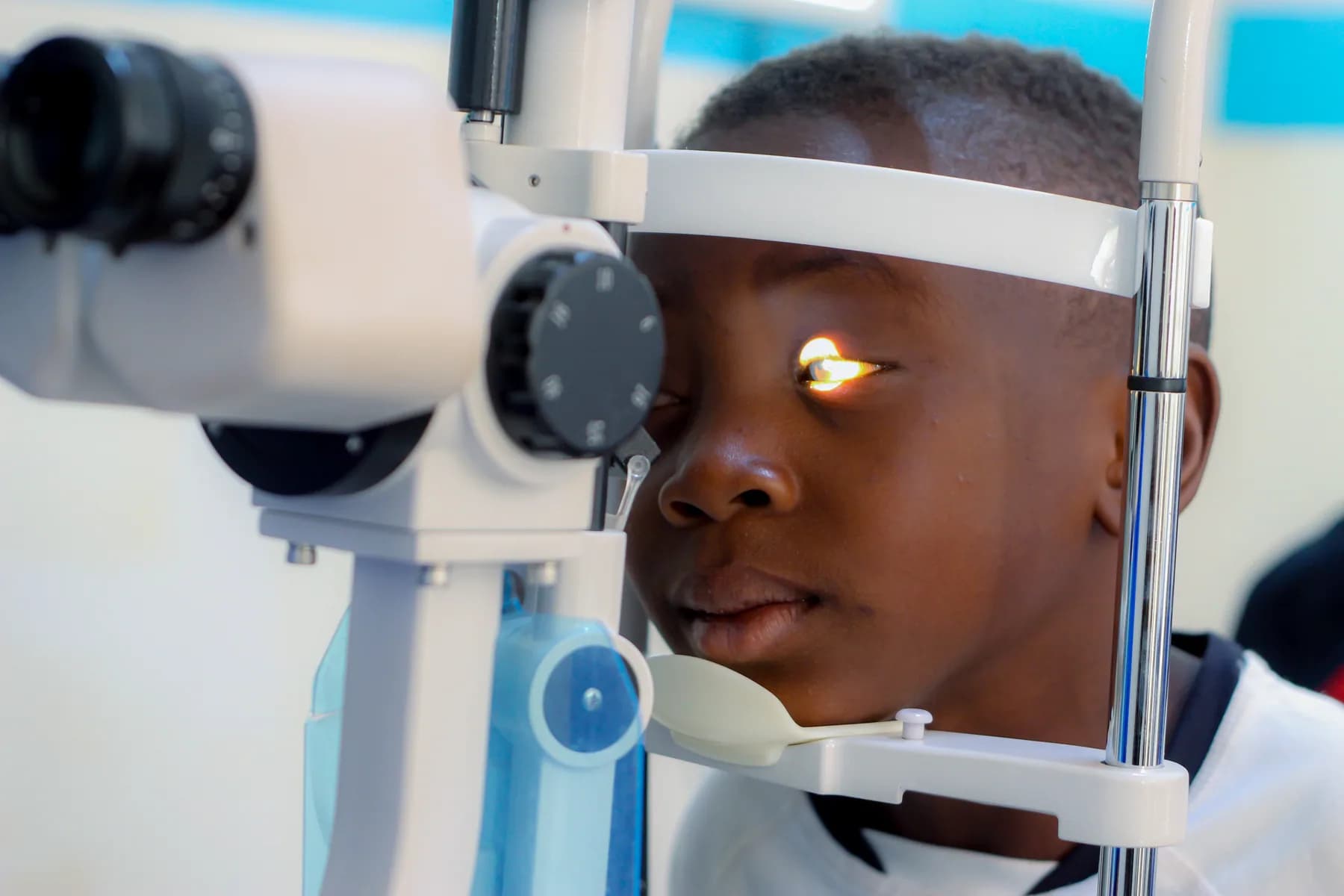 A patient receiving an eye screening