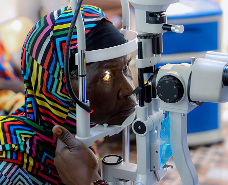 Patient receiving an eye screening at a mobile clinic