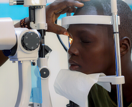 Cataract patient being examined with eye care equipment